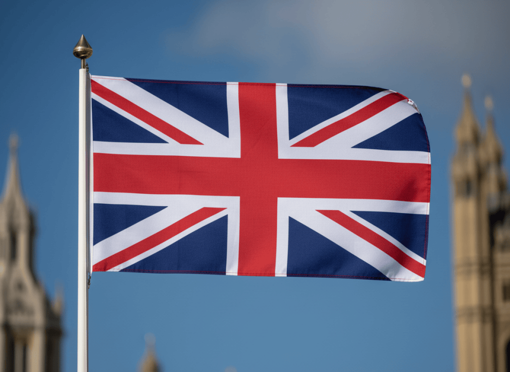 The Union Jack, the national flag of the United Kingdom. A rectangular flag with a deep blue background featuring the combined crosses of Saint George (red cross with white border), Saint Andrew (white diagonal cross), and Saint Patrick (red diagonal cross). Clean, accurate, and vibrant colors.